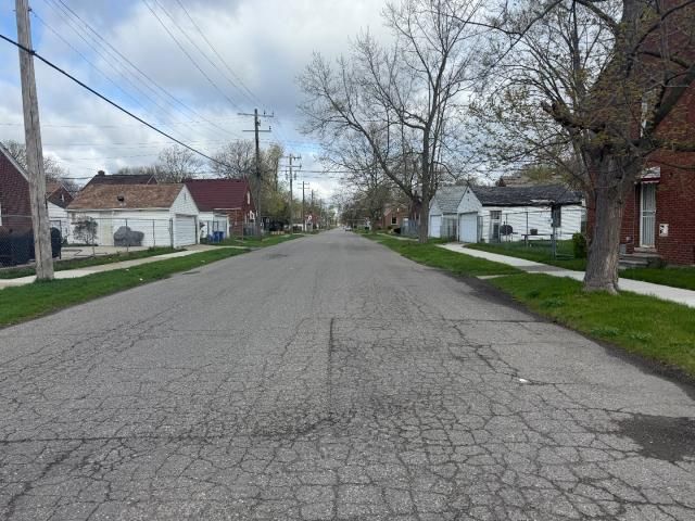 view of road with sidewalks and a residential view