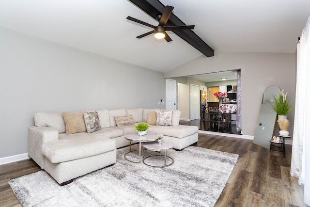 living room featuring baseboards, lofted ceiling with beams, a ceiling fan, and wood finished floors
