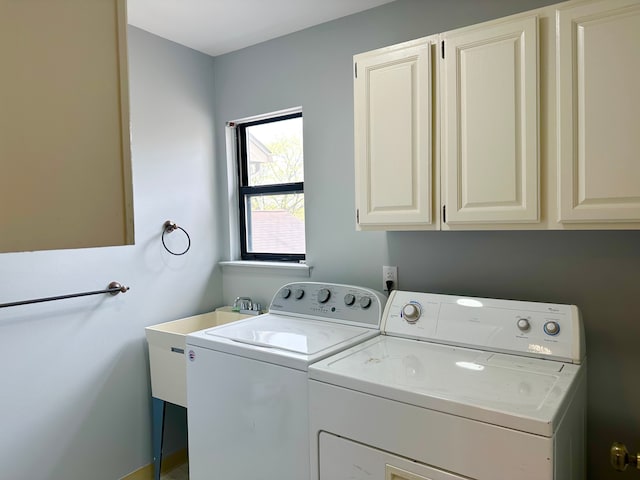 laundry area featuring cabinet space and washing machine and clothes dryer