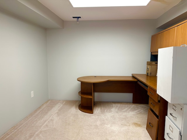 unfurnished office featuring light carpet