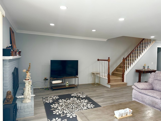 living area with crown molding, stairway, baseboards, recessed lighting, and wood finished floors