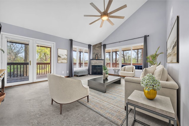 living room with carpet, high vaulted ceiling, ceiling fan, and a fireplace