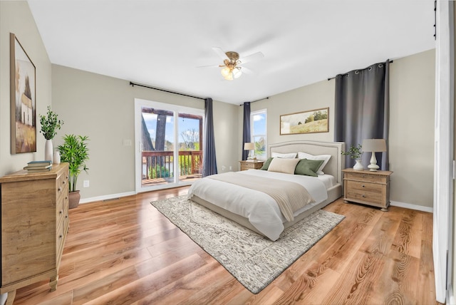 bedroom featuring baseboards, visible vents, access to exterior, and light wood-style floors