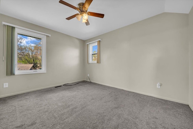 empty room featuring ceiling fan, visible vents, baseboards, and carpet