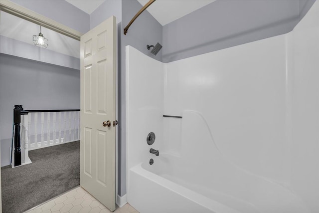 full bath with tub / shower combination and tile patterned flooring