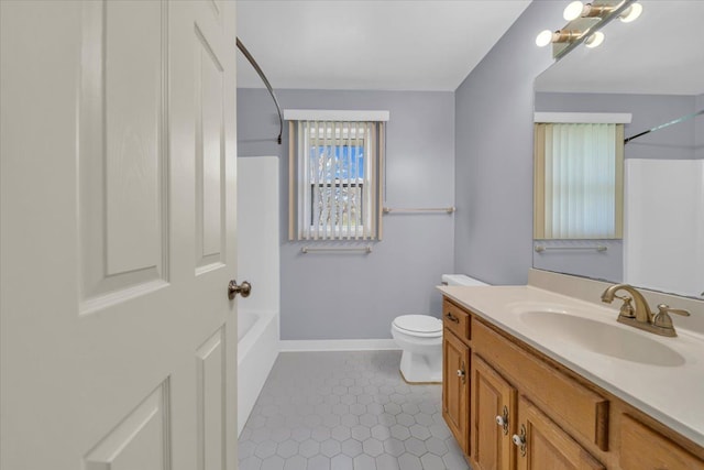 full bathroom featuring tile patterned flooring, bathtub / shower combination, vanity, toilet, and baseboards