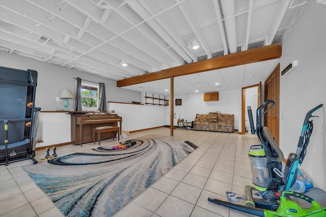 below grade area featuring tile patterned flooring and recessed lighting