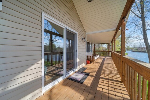 wooden terrace with a water view