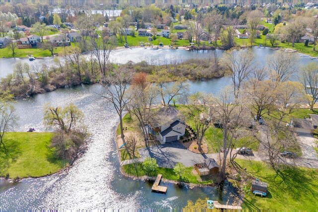 bird's eye view with a water view and a residential view