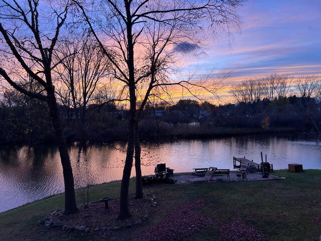 property view of water with a dock