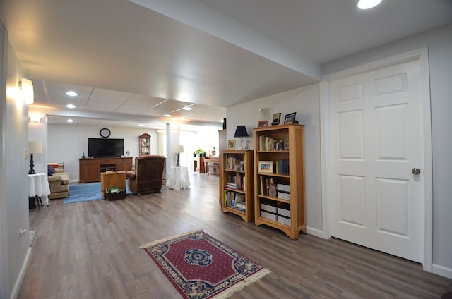 interior space with wood finished floors, recessed lighting, and baseboards