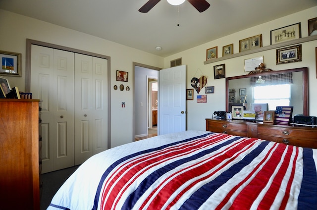 bedroom with visible vents, a ceiling fan, and a closet