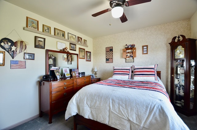 bedroom featuring ceiling fan, wallpapered walls, carpet floors, and baseboards