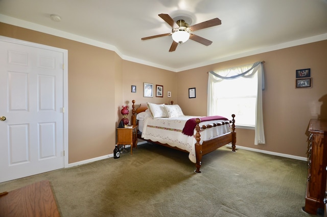 carpeted bedroom featuring baseboards and ceiling fan