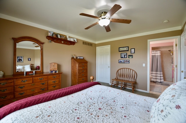 bedroom featuring ceiling fan, ensuite bath, visible vents, baseboards, and carpet floors