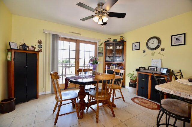 dining room featuring light tile patterned floors and ceiling fan