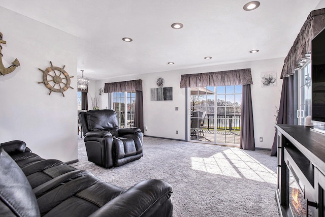 living room featuring recessed lighting, a healthy amount of sunlight, and carpet flooring