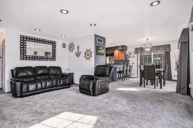 carpeted living area with recessed lighting, a notable chandelier, baseboards, and visible vents