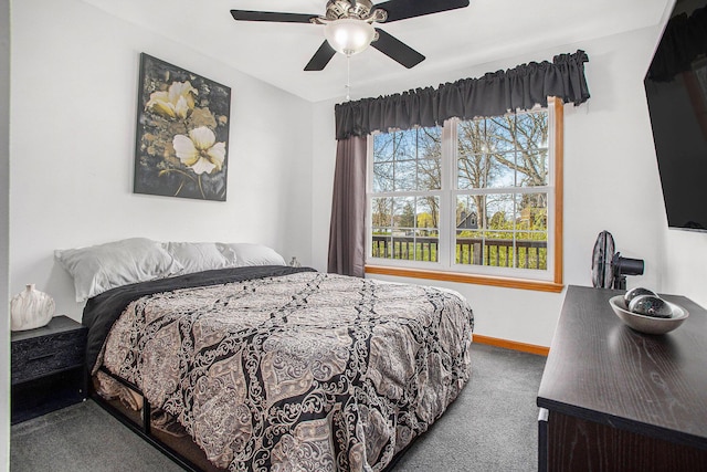 bedroom with baseboards, ceiling fan, and carpet