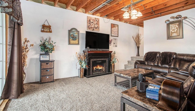 living area featuring carpet floors and a glass covered fireplace