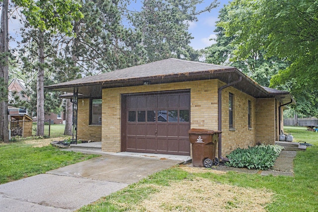904 W Walnut St, Hastings, MI 49058 - view of property exterior with brick siding, driveway, and a yard