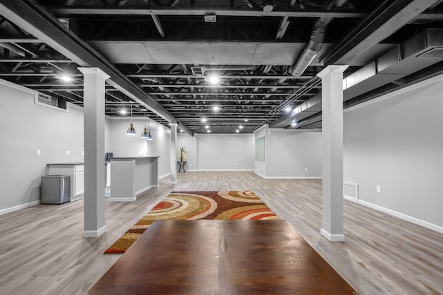 1249 Lasalle Rd, Canton, MI 48187 - finished basement featuring light wood-style floors, baseboards, and bar area