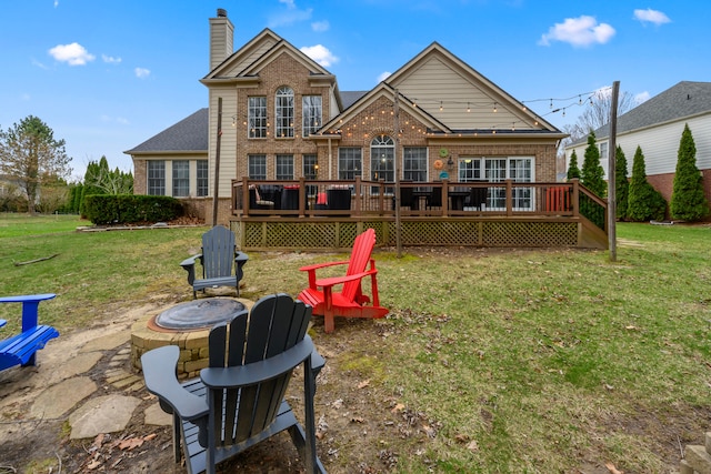 1249 Lasalle Rd, Canton, MI 48187 - rear view of property featuring an outdoor fire pit, brick siding, a yard, and a chimney