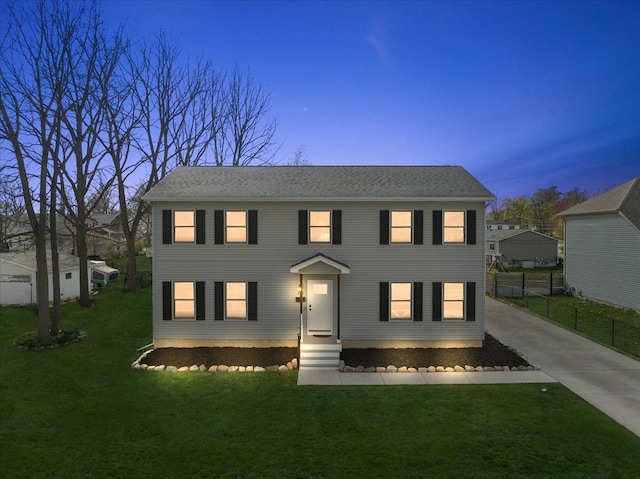 251 Dorsey St, Romeo, MI 48065 - colonial-style house featuring fence and a lawn