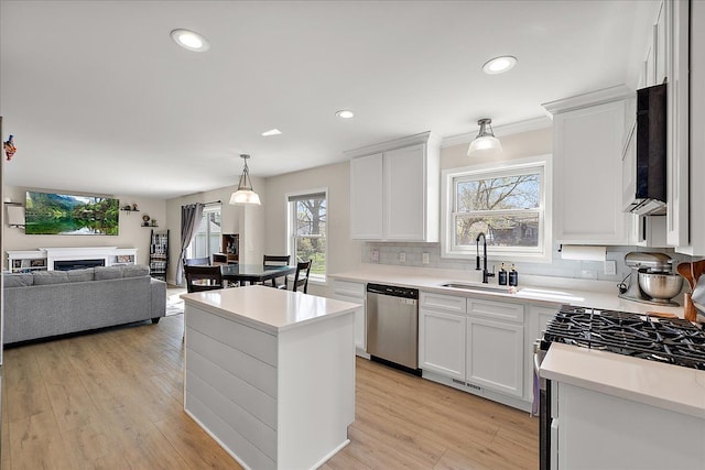 251 Dorsey St, Romeo, MI 48065 - kitchen with appliances with stainless steel finishes, decorative backsplash, light countertops, and a sink