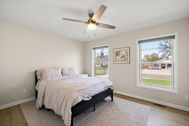 251 Dorsey St, Romeo, MI 48065 - bedroom featuring visible vents, baseboards, and multiple windows