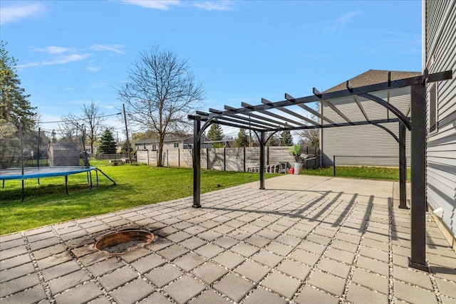 251 Dorsey St, Romeo, MI 48065 - view of patio with a trampoline, a fenced backyard, a fire pit, and a pergola