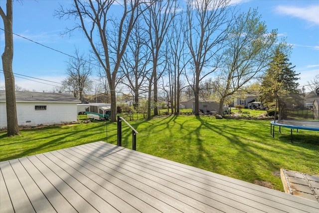 251 Dorsey St, Romeo, MI 48065 - wooden deck with a trampoline and a yard