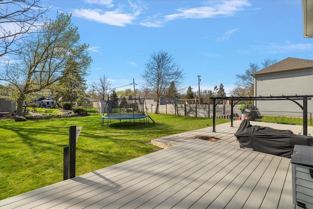 251 Dorsey St, Romeo, MI 48065 - wooden terrace with a lawn, fence private yard, and a trampoline