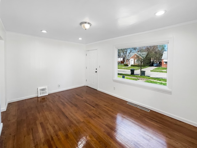 20612 Kingsville St, Harper Woods, MI 48225 - empty room with visible vents, baseboards, crown molding, and wood finished floors