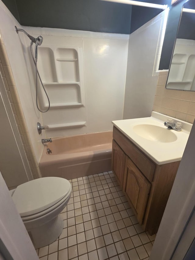 bathroom with toilet, tile patterned flooring, bathtub / shower combination, and vanity