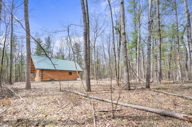 view of yard with a forest view