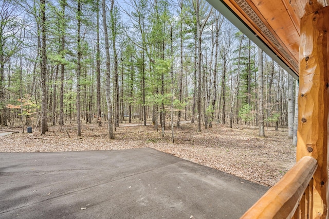 view of patio / terrace with a wooded view