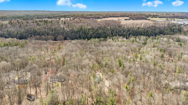 drone / aerial view featuring a forest view