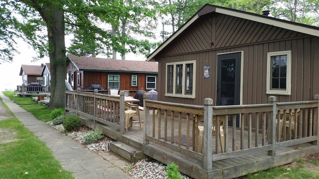 3974 W Houghton Lake Dr, Houghton Lake, MI 48629 - back of property featuring a deck