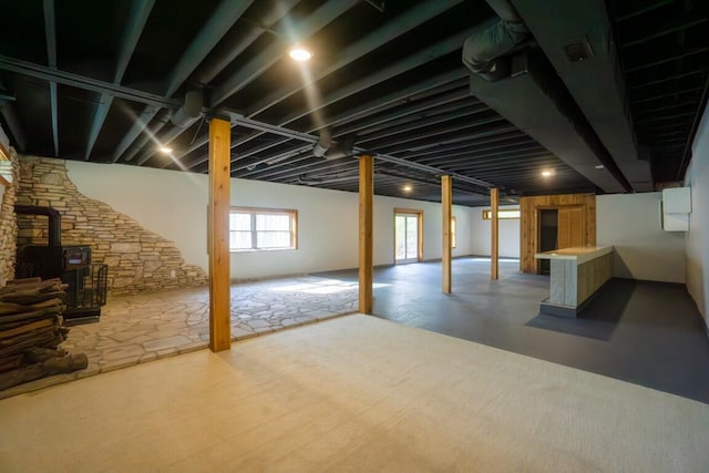 below grade area featuring a wood stove