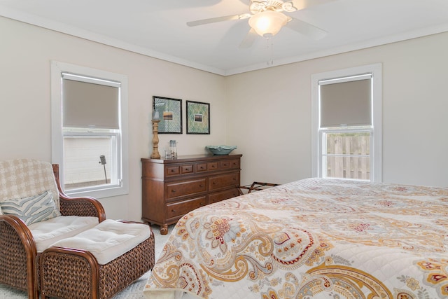 bedroom featuring ceiling fan and ornamental molding