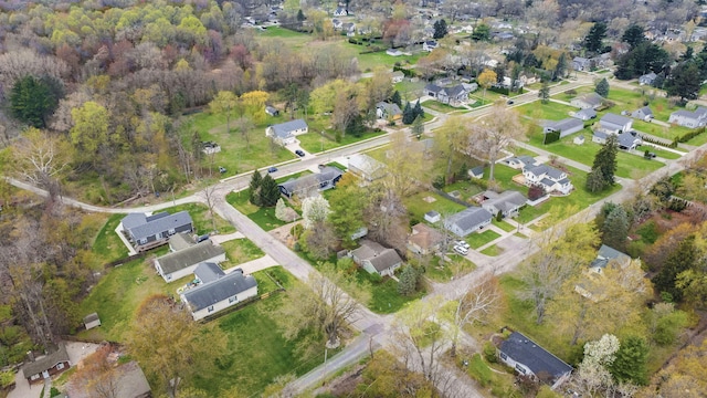 birds eye view of property with a residential view