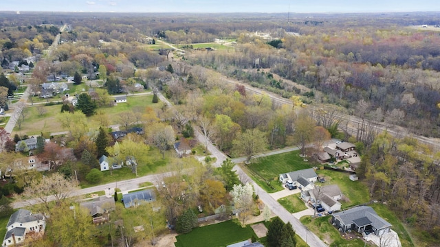 birds eye view of property featuring a residential view and a forest view