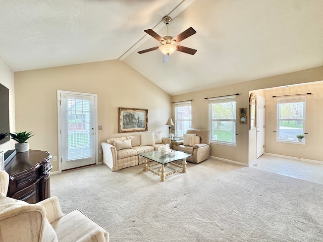 carpeted living area with baseboards, ceiling fan, and vaulted ceiling
