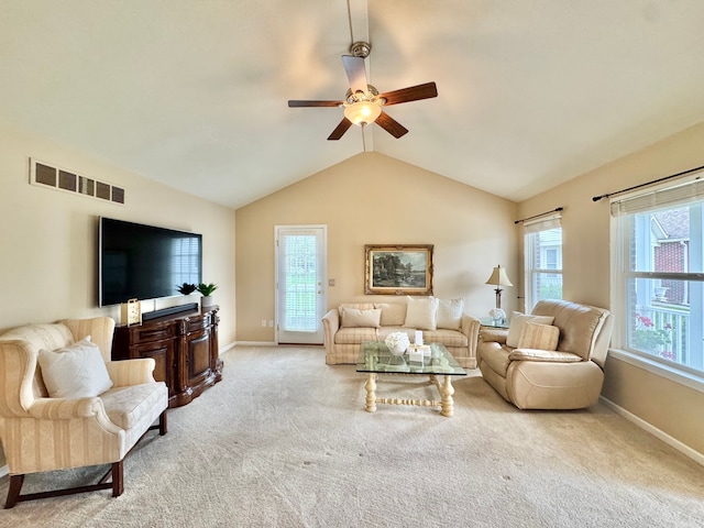 carpeted living area featuring lofted ceiling, visible vents, a ceiling fan, and baseboards