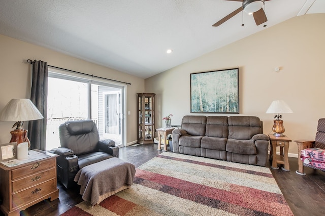 10207 Dodge Rd, Otisville, MI 48463 - living area with dark wood-type flooring, a ceiling fan, baseboards, and vaulted ceiling