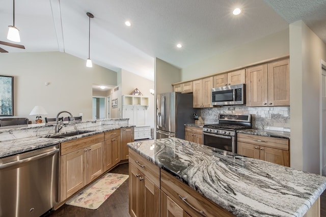 10207 Dodge Rd, Otisville, MI 48463 - kitchen featuring lofted ceiling, light stone countertops, tasteful backsplash, a sink, and stainless steel appliances
