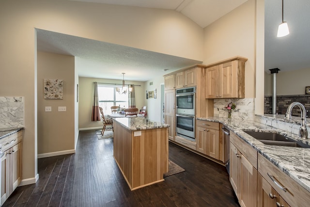 10207 Dodge Rd, Otisville, MI 48463 - kitchen with light brown cabinetry, stainless steel appliances, decorative backsplash, and a sink