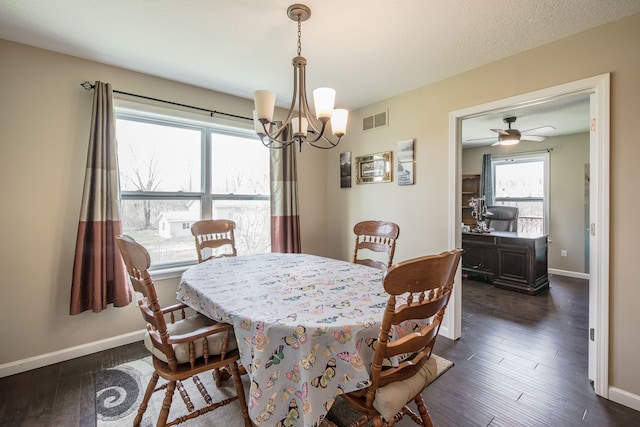 10207 Dodge Rd, Otisville, MI 48463 - dining space featuring dark wood-style flooring, a chandelier, baseboards, and visible vents