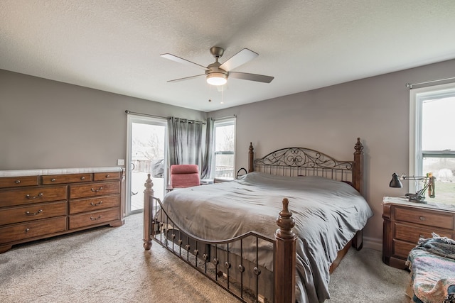 10207 Dodge Rd, Otisville, MI 48463 - bedroom with a ceiling fan, a textured ceiling, and light carpet